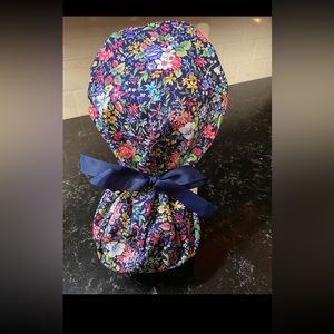 Floral scrub cap with buttons. Ponytail tie back. Handmade. Like new!